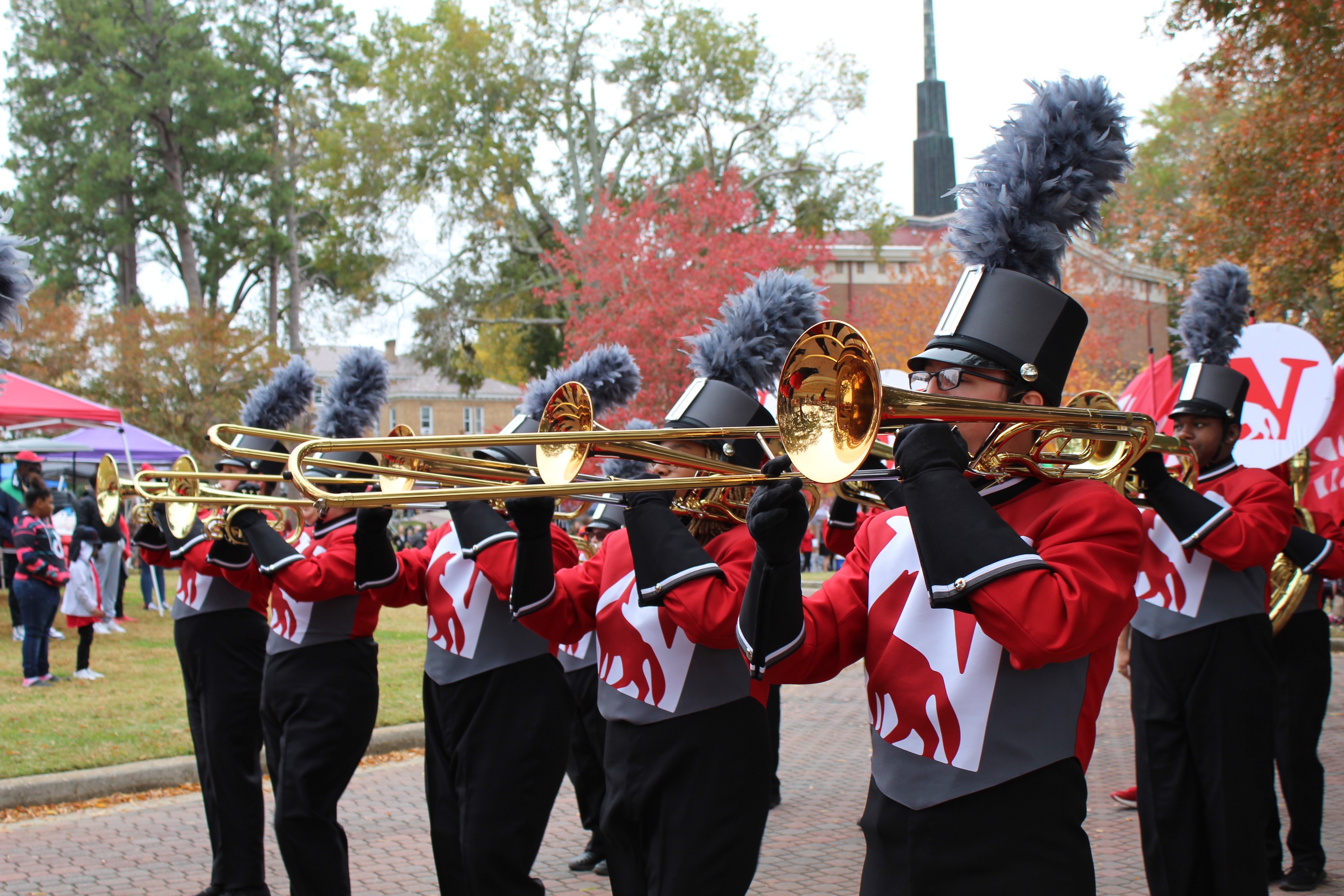 Trombone players of the Scarlet Spirit Marching Band at Homecoming