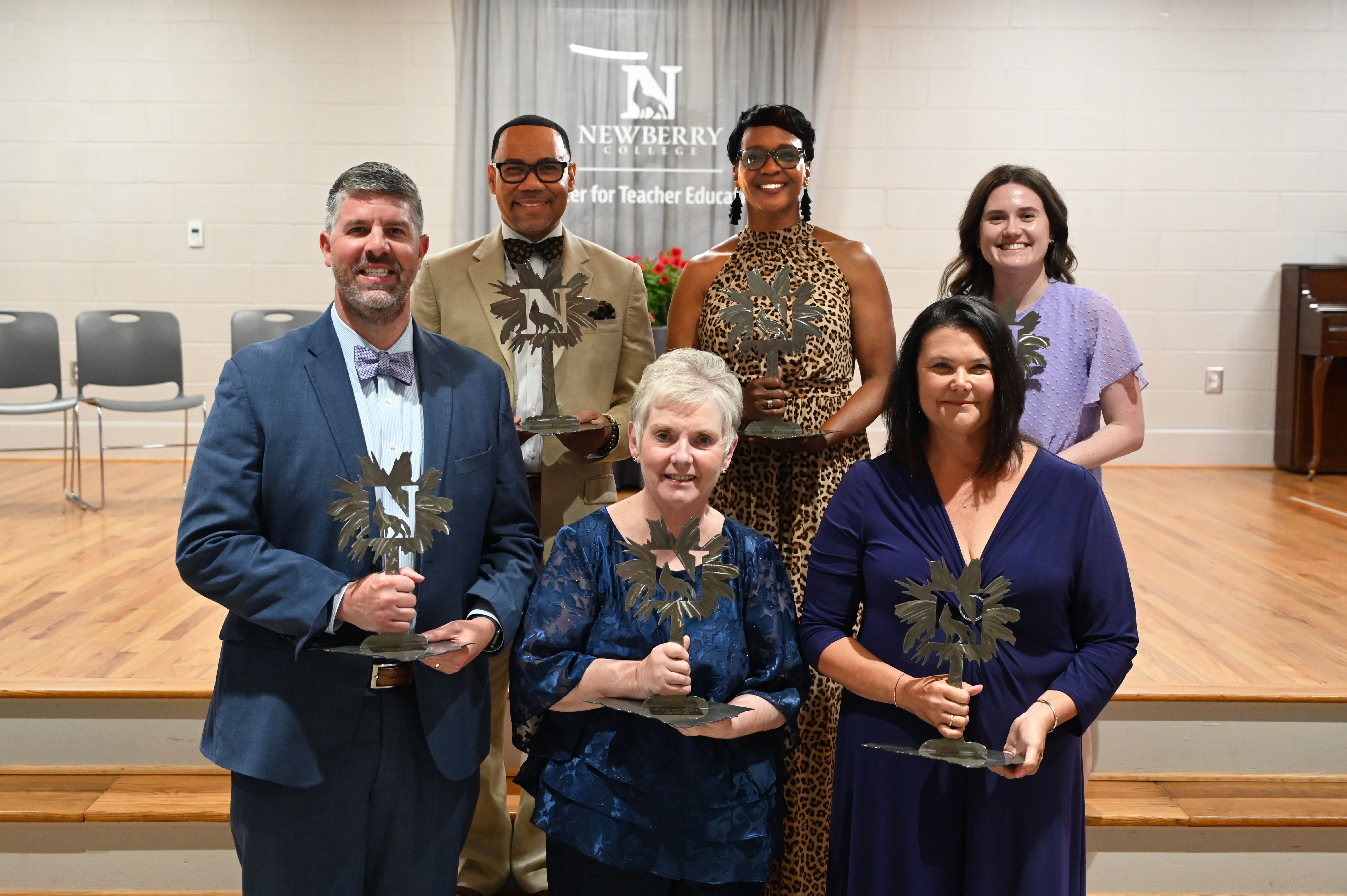 Photo: Back (left to right): Dr. Reggie Wicker '04, Kim Taylor '85, Hannah Carnes '18. Front (left to right): Dr. Andrew McMillan '05, Anne Caughman '67, Dr. Cindy Van Buren
