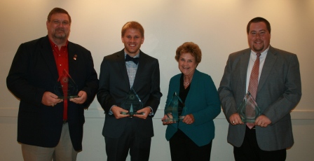 Four Master teachers holding awards